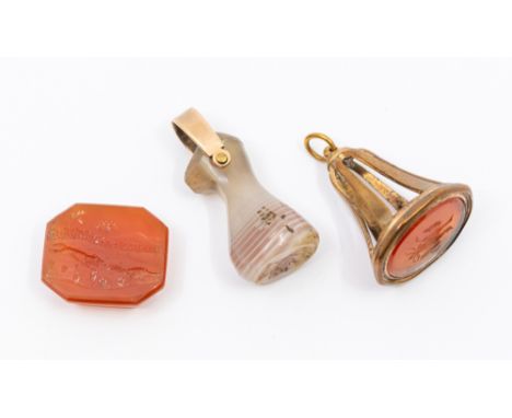 A collection of three 19th century hard stone seals to include a loose carnelian intaglio depicting a hunting scene, length a