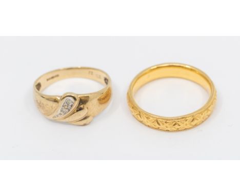 A 22ct gold band, comprising embossed foliate decoration, width approx 4mm, size K, weight approx 4.2gms along with a diamond