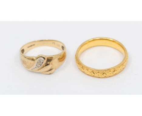 A 22ct gold band, comprising embossed foliate decoration, width approx 4mm, size K, weight approx 4.2gms along with a diamond