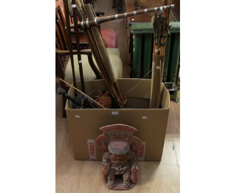 A mixed collection of 20th century South American items to include; a Peruvian mask, a long wooden hand made Bagpipe style mu
