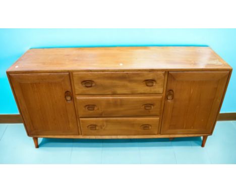 Lucian Ercolani, for Ercol, a 1960s long sideboard, model 455, in elm of three central drawers and two side cupboards, some w