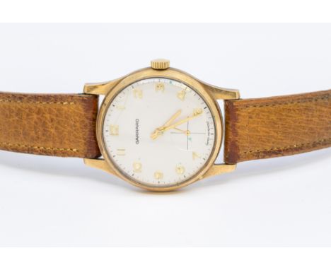 Garrard- a gentleman's vintage 9ct gold wristwatch, comprising a signed silvered round dial with applied gilt Arabic hour ind