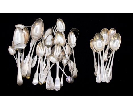 A collection of 19th and early 20th Century silver flatware to include table spoons, dessert spoons, dessert forks, teaspoons