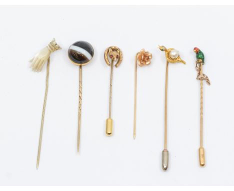 A collection of Victorian and later stick pins to include a gold and enamel parrot cased, (some enamel loss) assessed as 9ct 