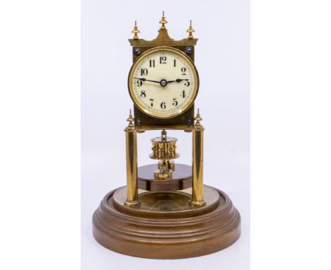An early 20th century Gustav Becker German domed clock, brass workings, enamel dial and with glass dome. Marked to reverse of