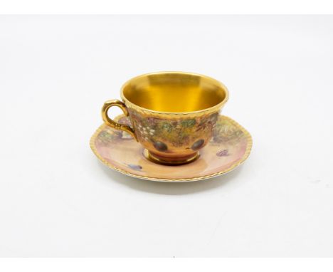 James Skerett for Royal Worcester - A hand painted cup and saucer, with elaborate gilding, signed and titled "Hand Painted Fr