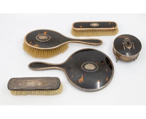 A collection of 20th century silver and tortoiseshell style dressing table items to include; a four footed circular trinket/r