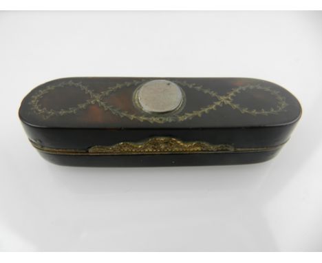 A George III tortoiseshell and silver inlaid patch box, inlaid vacant cartouche with in tendrils inlaid vacant design, with b