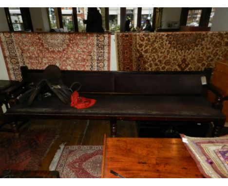 An early 20th century oak bench. H.90cm W.3m