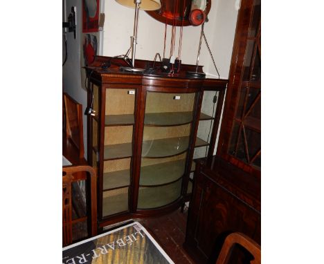 An Edwardian mahogany and satinwood bow fronted display cabinet. H.165cm W.116cm