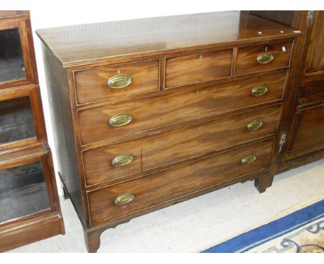 A Victorian mahogany chest of drawers, the plain single frieze top with a moulded edge over three short and three long drawer