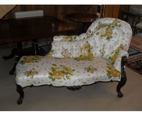 A Victorian chaise longue with button back and glazed floral upholstery, serpentine front and carved cabriole legs   CONDITIO