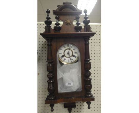 A circa 1900 walnut cased Vienna type regulator, the circular enamel dial with Roman numerals