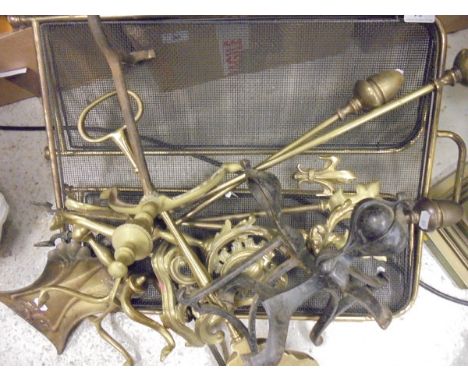 A set of brass fireside tools, firedogs, door porter, folding brass fire screen, a brass table lamp Corinthian column and ass