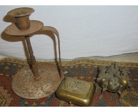 A Continental iron chamber stick in the Coburg style, a Italian steel letter opener, a brass case and an unusual six section 