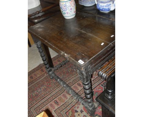 A 17th century and later oak side table, formerly with drawer and with other alterations, raised on bobbin turned supports to