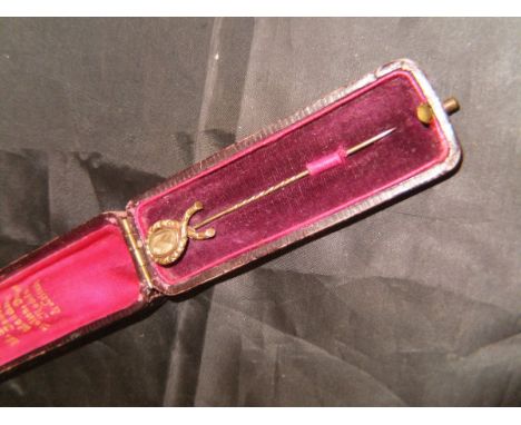 A yellow metal and hair plait decorated memento Mori stick pin inscribed "George Waldock Ob 28 Dec 1854 aged 61", cased