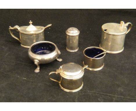 A collection of various silver and white metal wares to include silver drum shaped mustard, silver cylindrical pepper, silver