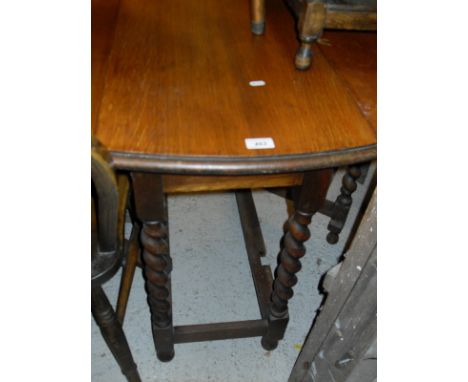 An oak drop-leaf oval dining table with barley twist supports, an elm seated stick back chair, folding step-ladders, an oak f