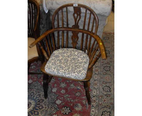 A carved mahogany Eastern style octagonal occasional table with high relief carving to the top depicting leaves and fruit rai