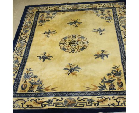 A Chinese superwash carpet, the central panel set with floral sprays on a cream ground within a stepped cream and blue floral