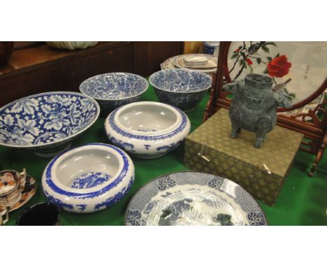 A pair of 20th Century Chinese blue and white decorative bowls each bearing six character marked to base within a double ring