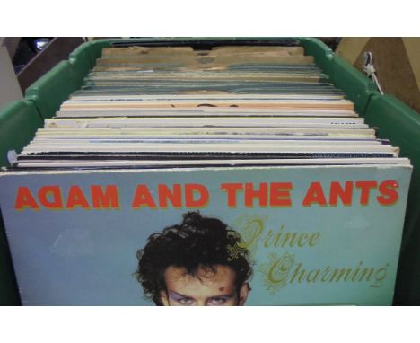 Four boxes of miscellaneous items to include one box of records including Adam and the Ants "Prince Charming", a box marked "