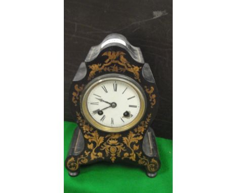A 19th Century ebonised and marquetry inlaid cased French mantle clock, the eight-day movement with enamel dial and Roman num