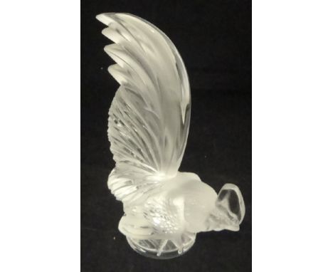 A Lalique glass figure of a cockerel, his head close to the ground, tail plumes high into the air marked "Lalique France" to 