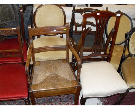 A 19th Century Beech and Elm bar back carver chair with rush seat raised on square tapered legs together with a Victorian spo