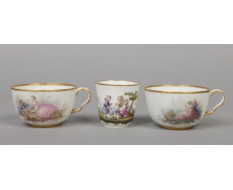 A pair of Sevres breakfast cups with gilt dentil rims and enamelled with Watteauesque scenes, printed marks. Along with anoth