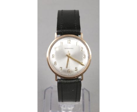 A Garrard 9 carat gold cased presentation manual wristwatch. With satin dial and applied Arabic numeral markers, 32mm wide.Co