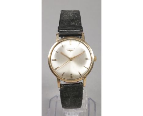 A gentleman's Longines yellow metal manual presentation wristwatch.With satin dial, baton markers and centre seconds, 34mm wi