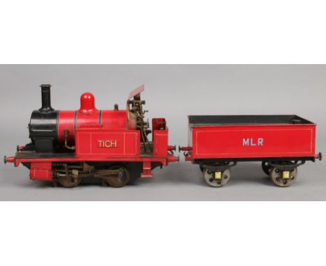 A 3.5" gauge 0-4-0 live steam tank engine and tender.&nbsp; With red livery, the engine named Tich and the tender MLR.