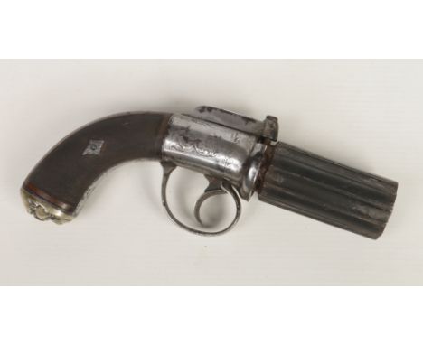 A mid 19th century six-shot pepperbox revolver. With fluted barrels, engraved round action, knurled walnut scales and steel l
