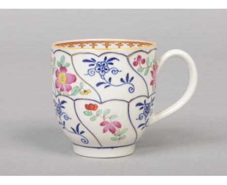 A rare Worcester coffee cup with grooved loop handle. Painted in underglaze blue with the Queen's Floral pattern, the normall