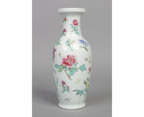 A Chinese Republic period baluster shaped vase. Painted in coloured enamels with scattered flowers, butterflies and a dragonf