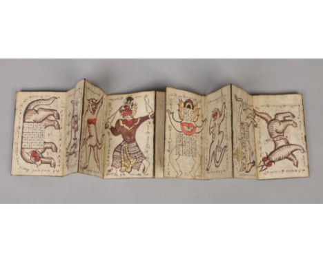 A Burmese Parabaik (tattoo book) with carved wooden boards and accordion folded hand made paper. Decorated throughout with fi