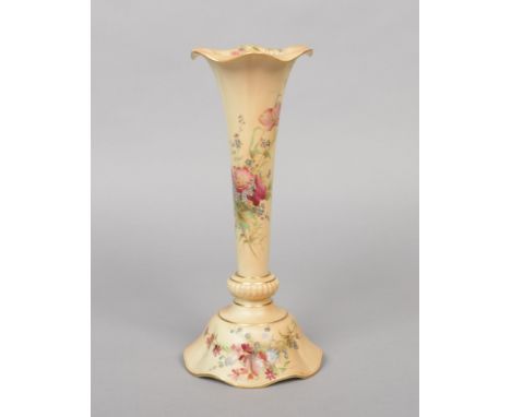 A Royal Worcester trumpet shaped blushware vase. Decorated with flowers and gilded. Printed puce mark, date code for 1911, 29