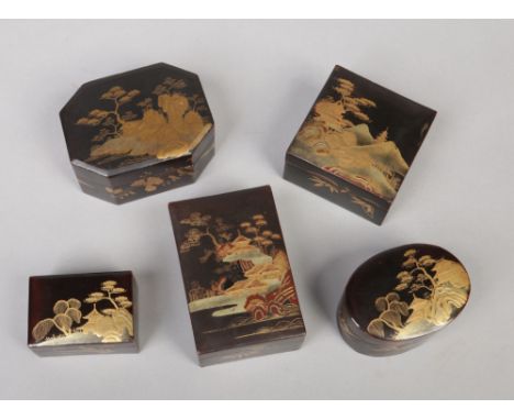 Five Japanese lacquered trinket boxes. Each decorated in gilt with pagoda landscapes. Largest 10.25cm wide.&nbsp;Condition re
