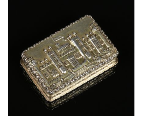 A Victorian silver gilt "castle top" vinaigrette by Nathaniel Mills. Decorated on a textured ground with a cast view of Winds