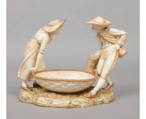 A Royal Worcester figural blushware centrepiece by James Hadley. Modelled as a lady and gent conversing around a large basket