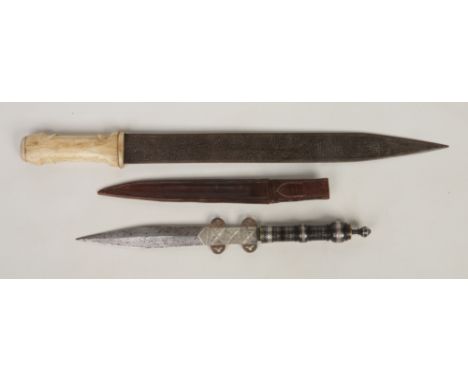 A 19th century Eastern hunting knife in associated leather sheath, with turned hardwood grip having silver wire inlay and a b