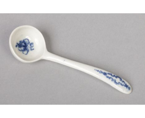 A rare Caughley mustard spoon. Painted in underglaze blue with a flower sprig to the bowl and a symmetrical scroll design to 