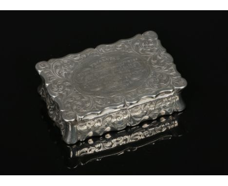 A Victorian silver presentation snuff box by Hilliard &amp; Thomason. With serpentine edge and engraved with scrolling acanth