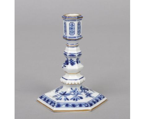 A Meissen blue and white candlestick of hexagonal form. Painted in underglaze blue with the Onion pattern and with gilt edgin