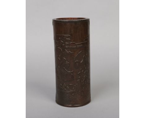 A Chinese carved bamboo bitong. Decorated in light relief with carp amidst aquatic weeds and with four characters to the reve