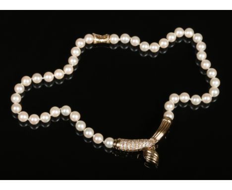 A ladies pearl necklace with 9 carat gold clasp and pendant set with diamonds.&nbsp;
