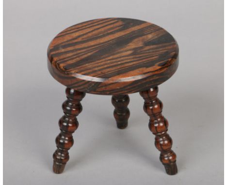 A simulated rosewood lace makers lamp stool raised on bobbin turned supports, 15cm.Condition report intended as a guide only.