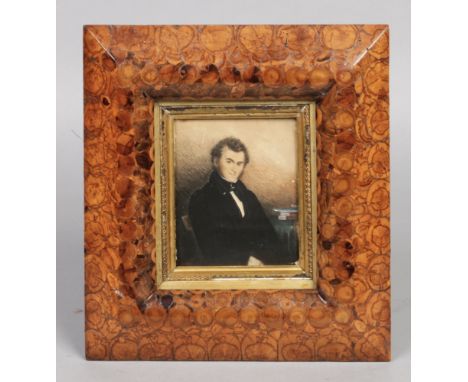 A 19th century watercolour portrait miniature of a gentleman in oyster veneered cushion shaped frame, 14cm x 12cm.Condition r